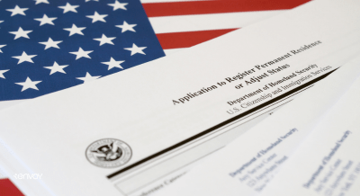 Image of the U.S. flag with paperwork layered overtop reading "application to register permanent residence or adjusted status".